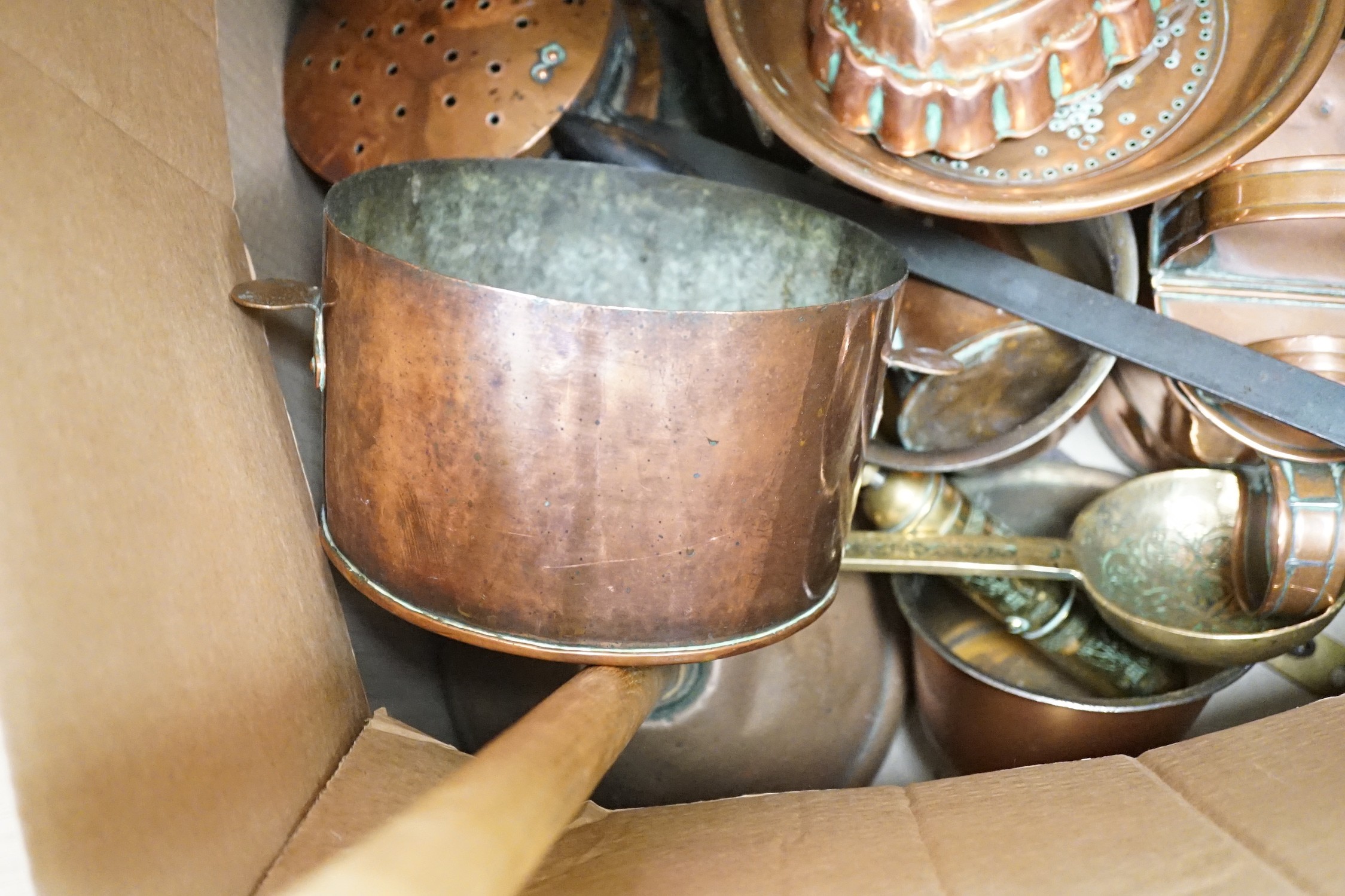 A quantity of various copper and brass to include jelly moulds, trivets, watering cans etc.
